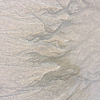 Distinct grain and current in beach texture
