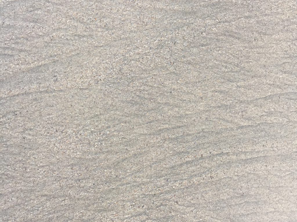 Off white sand featuring grain and ripples