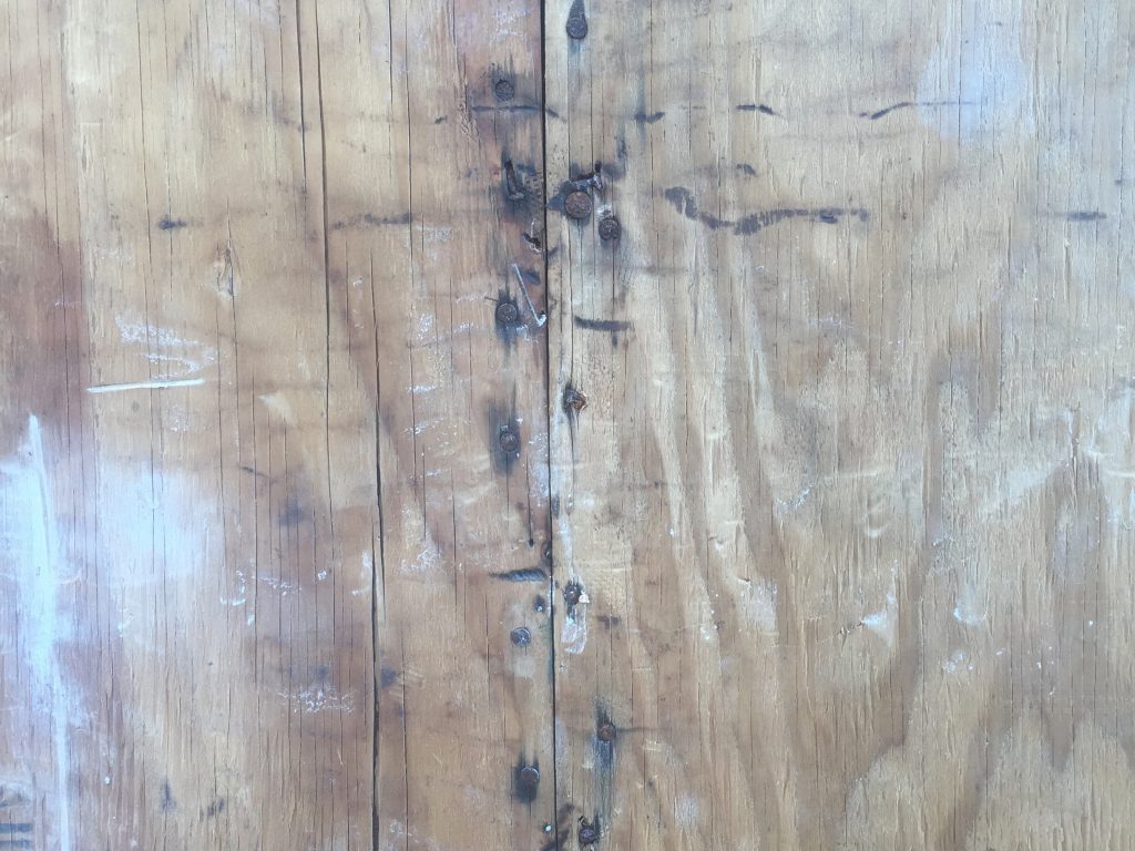 Old plywood with rusty nails