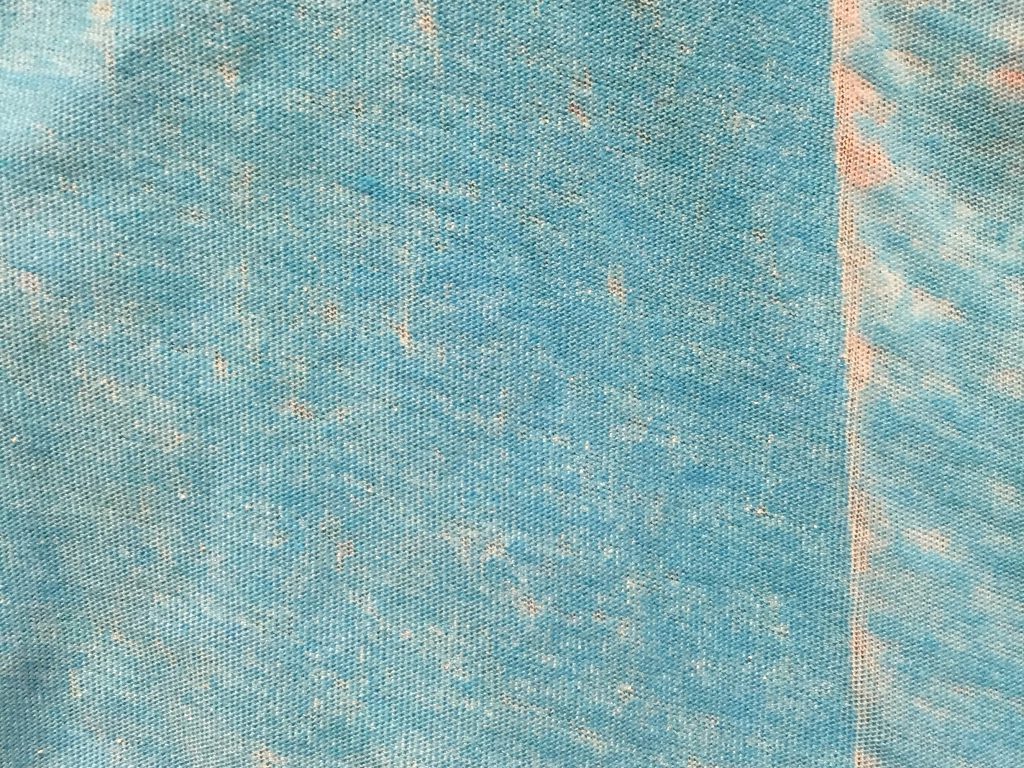 Discolored and weathered old blue cloth