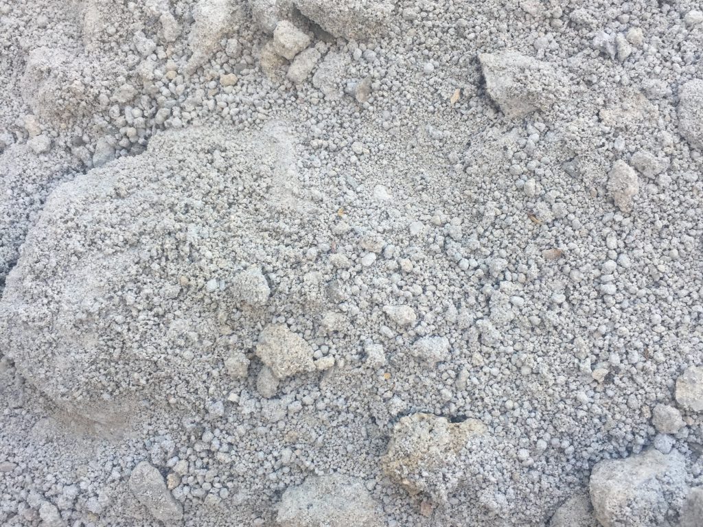 Clumps of gray dirt covering rocks