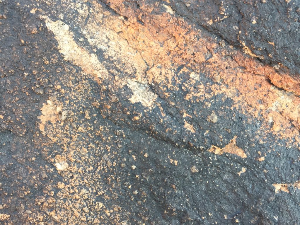 Black rock close up with diagonal texture