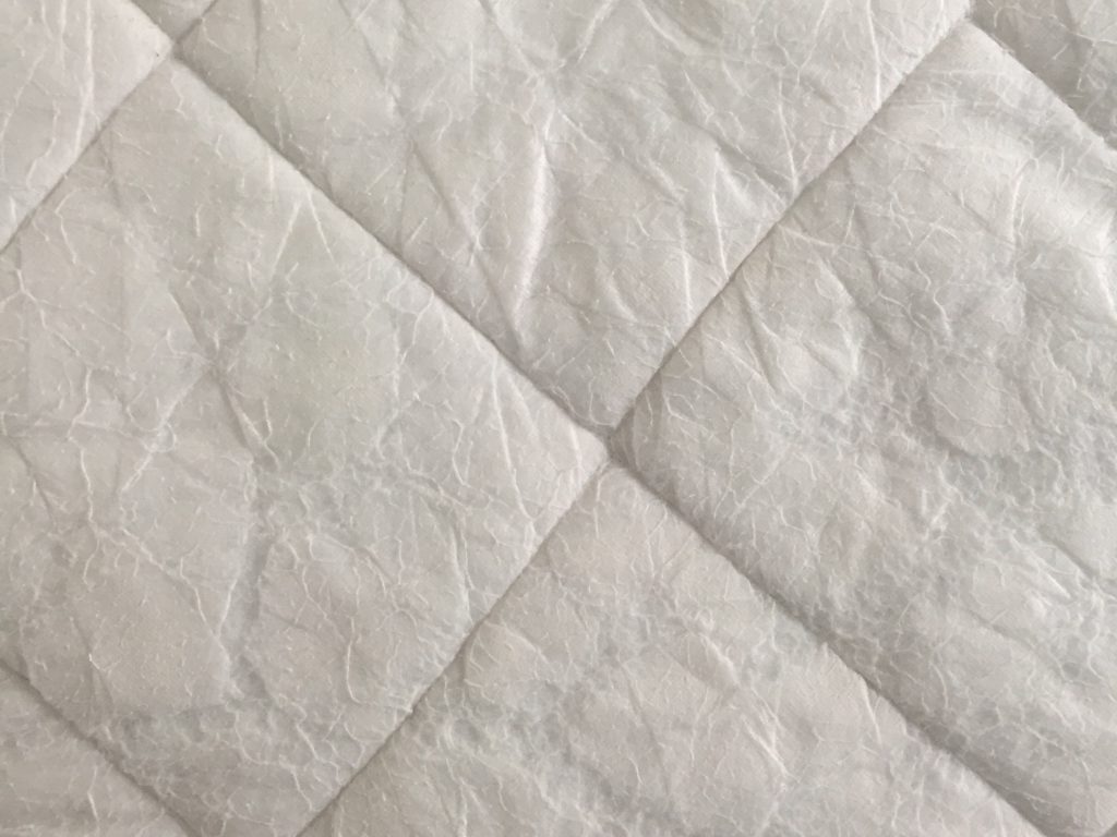 Diamond pattern in white cloth padding