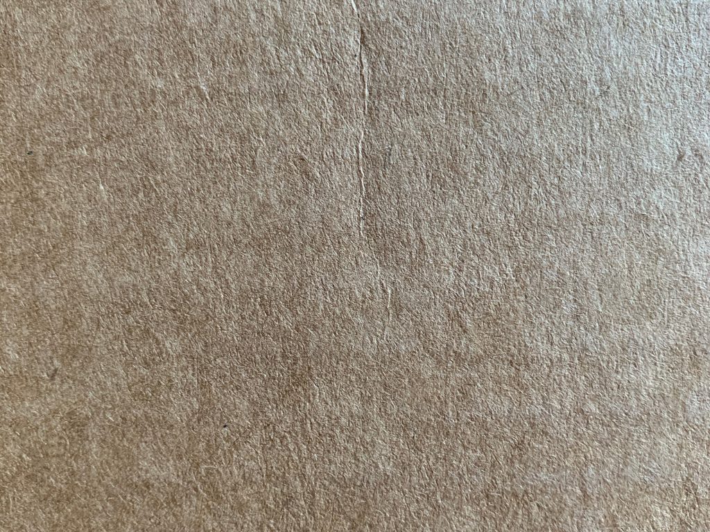 Click here to see High Resolution Image Light brown detailed shot of fine paper texture