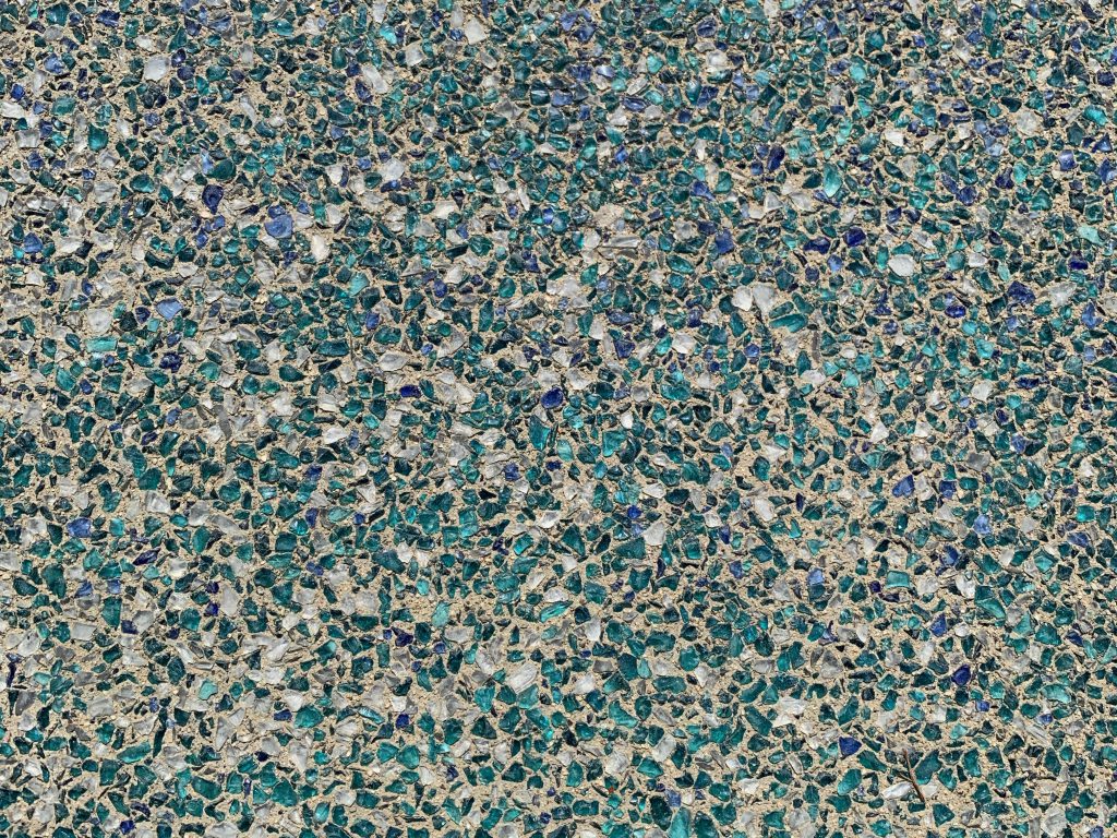 Blue/green glass embedded in concrete