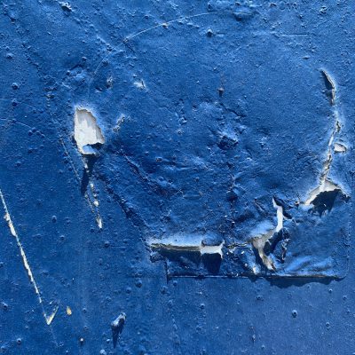 Flaking and cracking blue paint