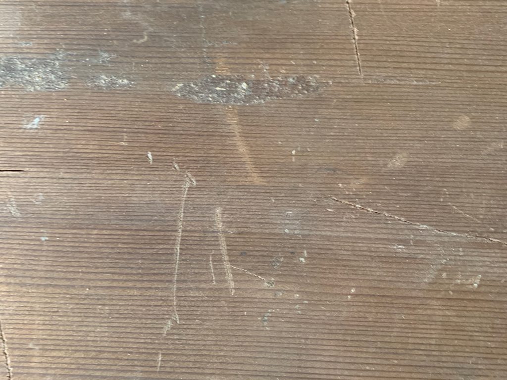 Wood board with scratches and dents
