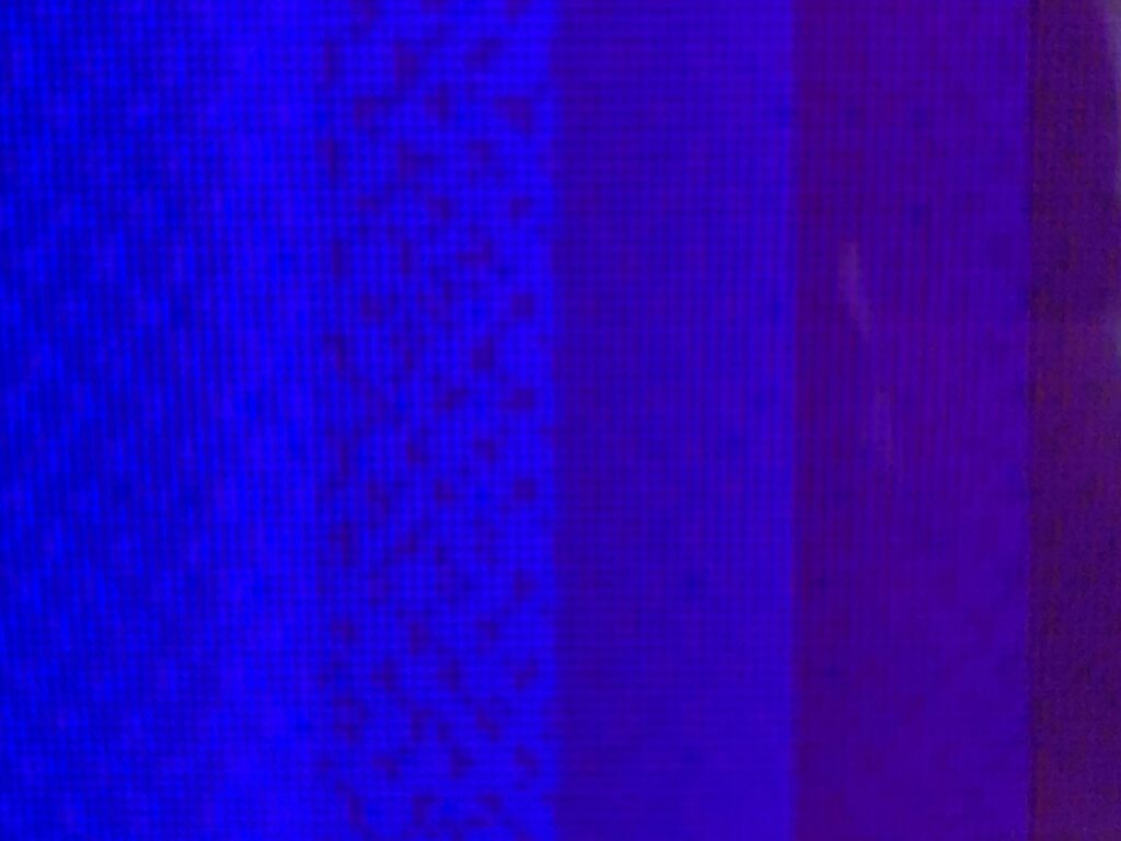Vertical bars of varying hues of blue pixels