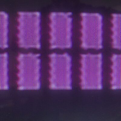 Bright purple rectangles over dark pixel background
