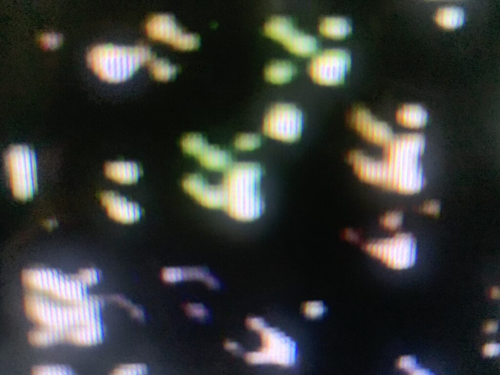 Blurry digital shapes on black