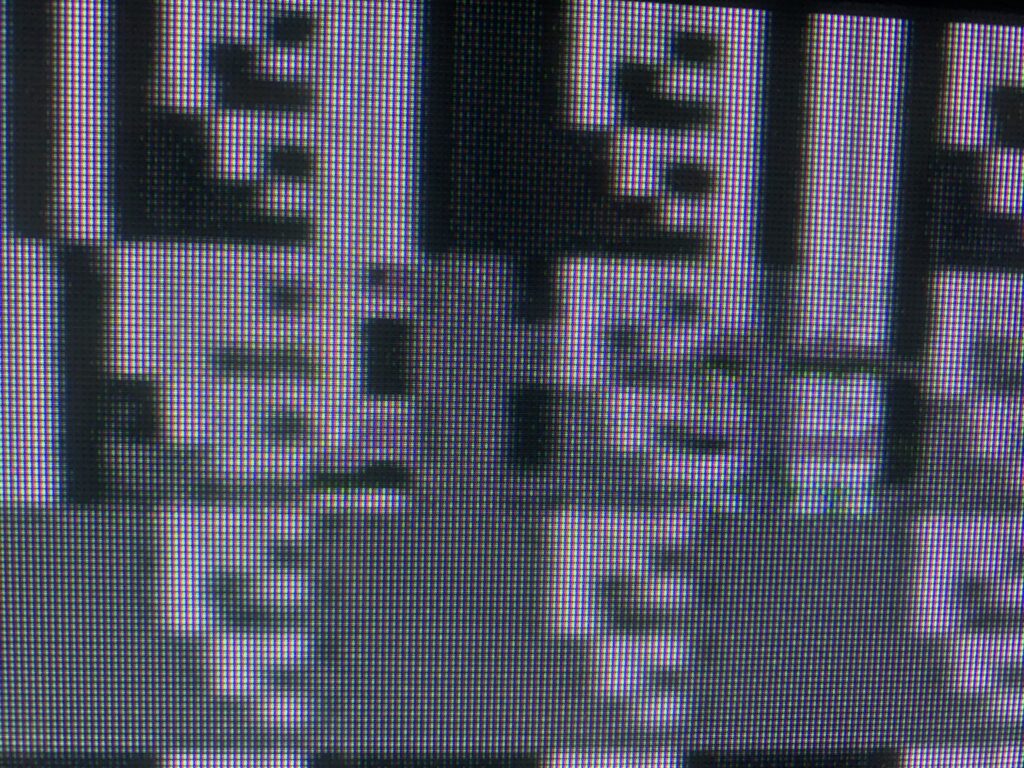 Grayscale glitching retro video game tile