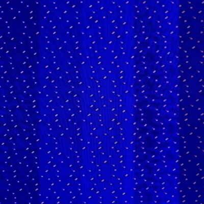 Hundreds of white dots in pattern over blue