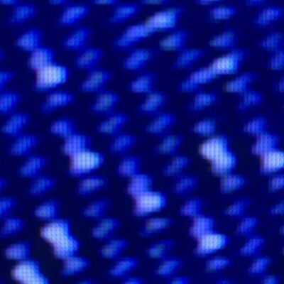 Diagonal white blobs on dark blue digital grid