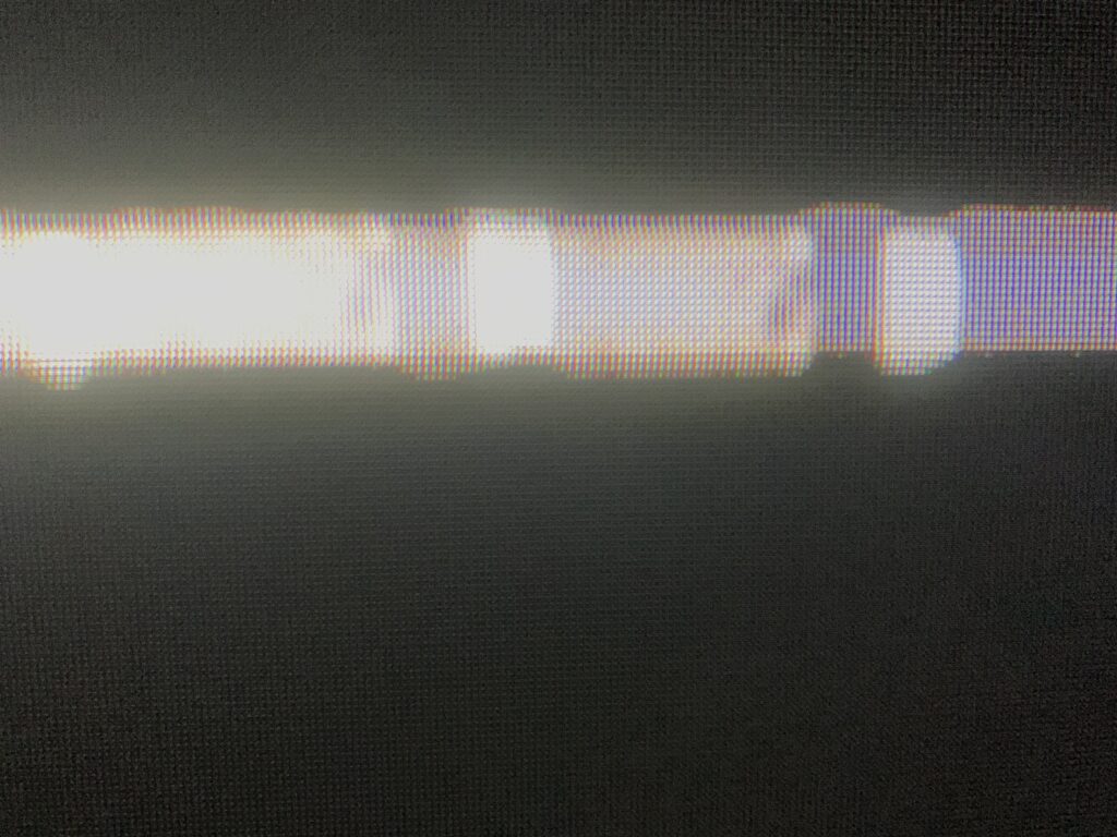 Black LED screen with vibrant white bar streak