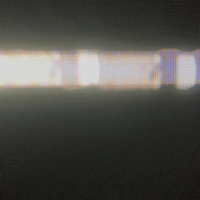 Black LED screen with vibrant white bar streak