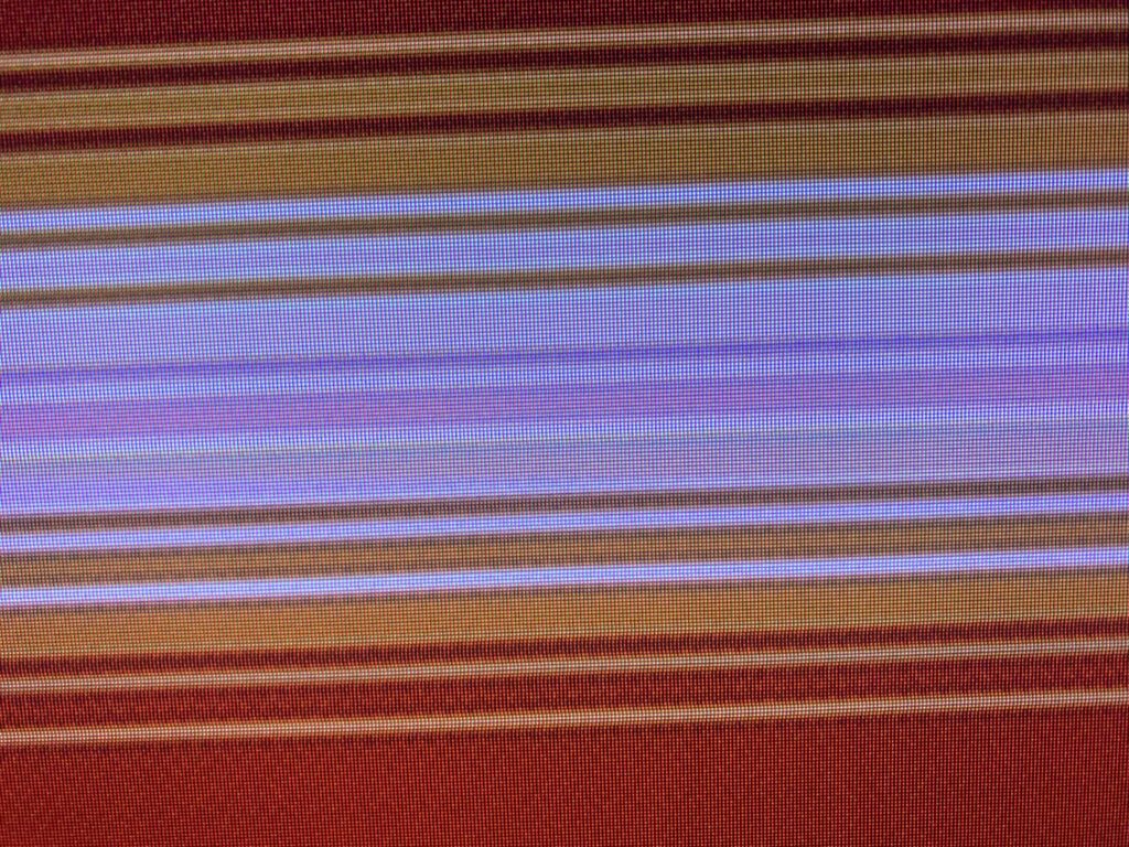 Horizontal bars of red, orange, white and purple