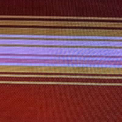 Dark red digital pixel grid with bands of white, pink and orange/yellow