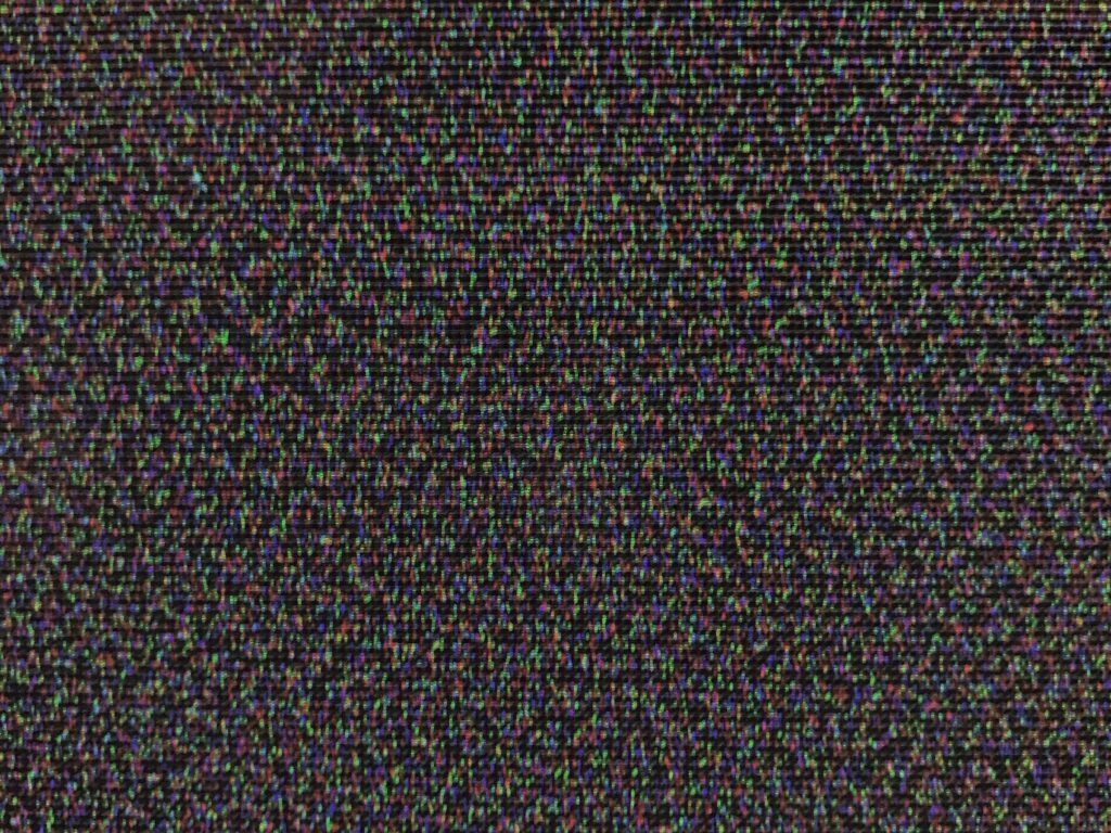 Dense clusters of pixels on black background