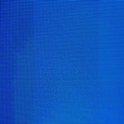Vibrant blue digital checkered pattern creating skewed grid