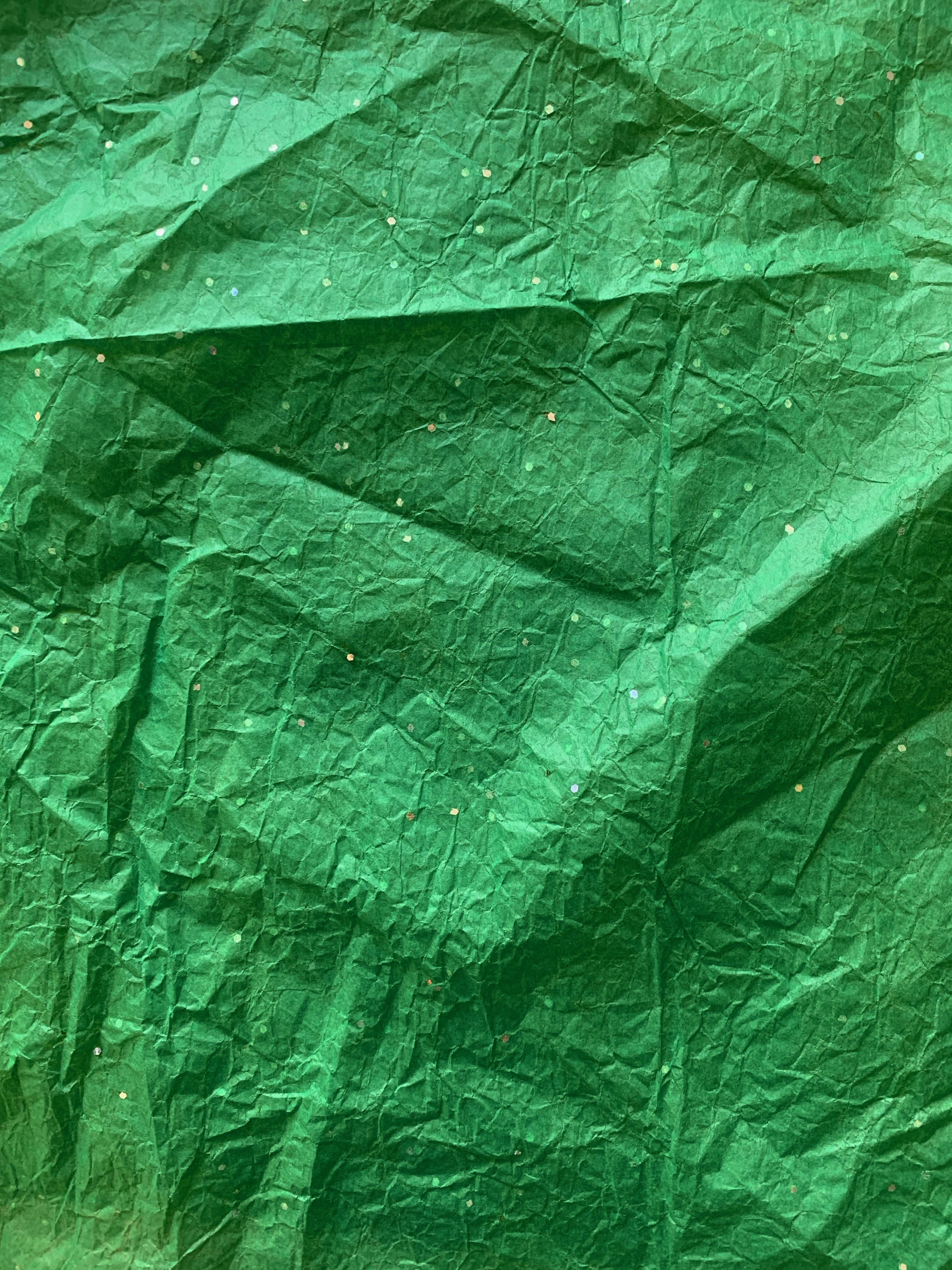 Wrinkled thin green wrapping paper