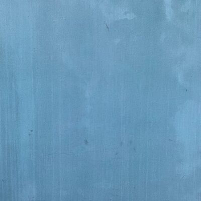 Dull blue wall with discoloration