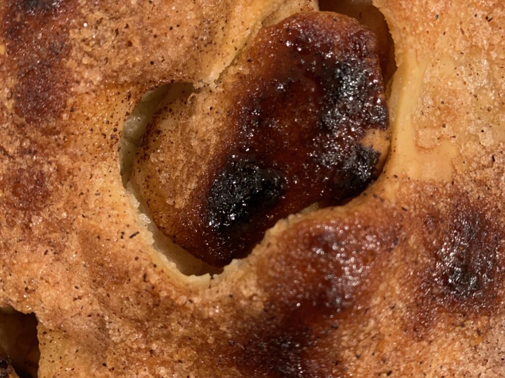 Apple pie crust close up with some slightly burnt areas