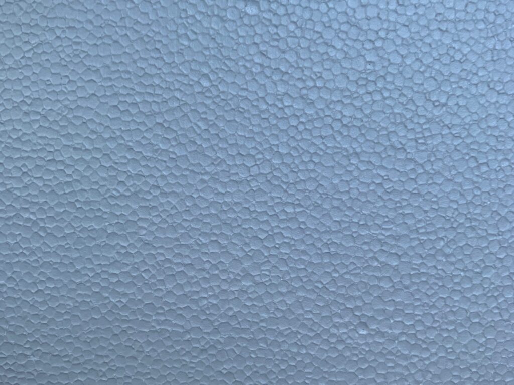 Baby blue foam with small circles covering surface