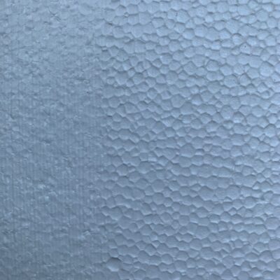 Close up foam surface with large circles and muted texture on left