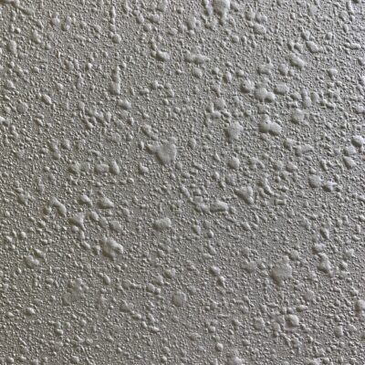 Bumpy white wall with organic like shapes varying in size