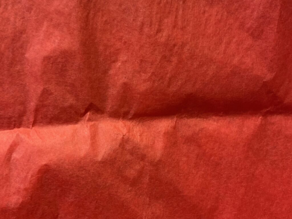 Vibrant red paper with visible fibers creating nice texture