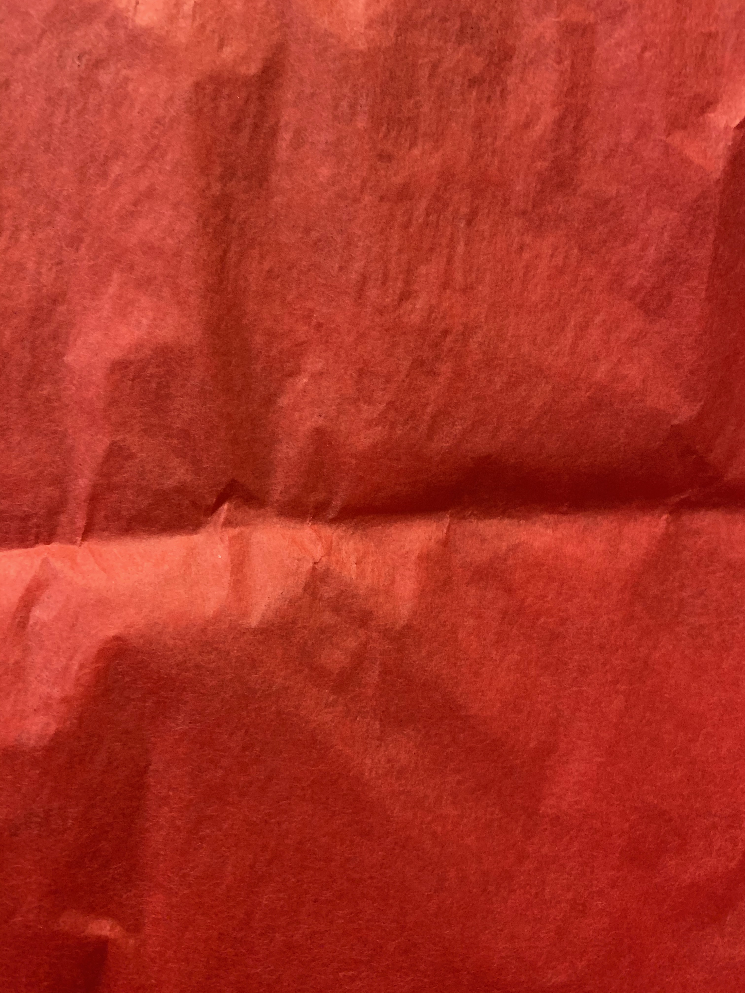 Vibrant red paper with fiber texture