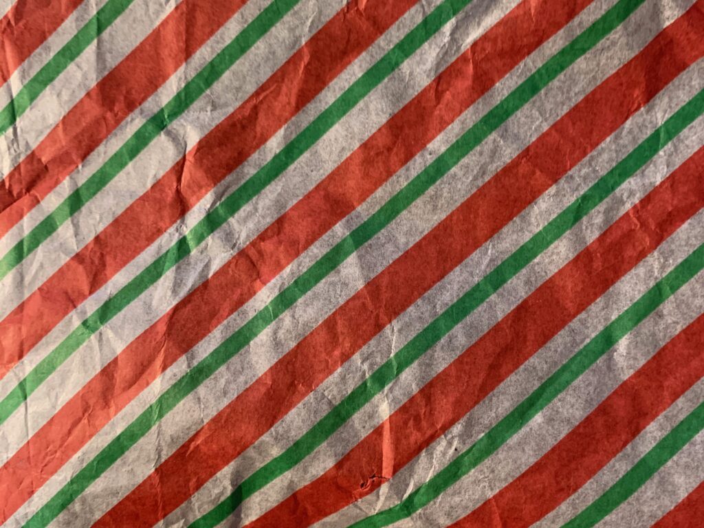 Red green and white stripes on decorative paper