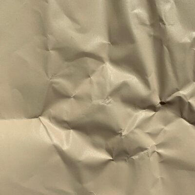 Tan semi-gloss paper with wrinkles and folds