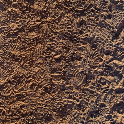 Golden brown dirt with footprints