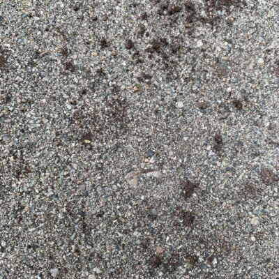 Rocky asphalt with black spots