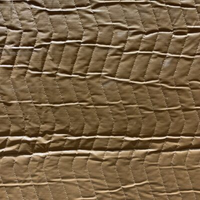 Brown plastic fabric with stitching
